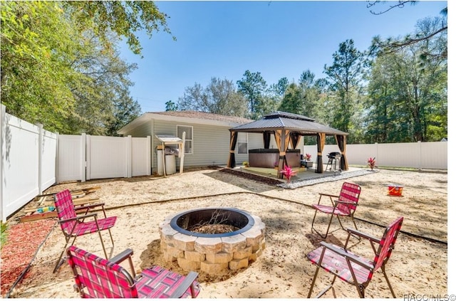 view of patio / terrace with a gazebo and an outdoor fire pit