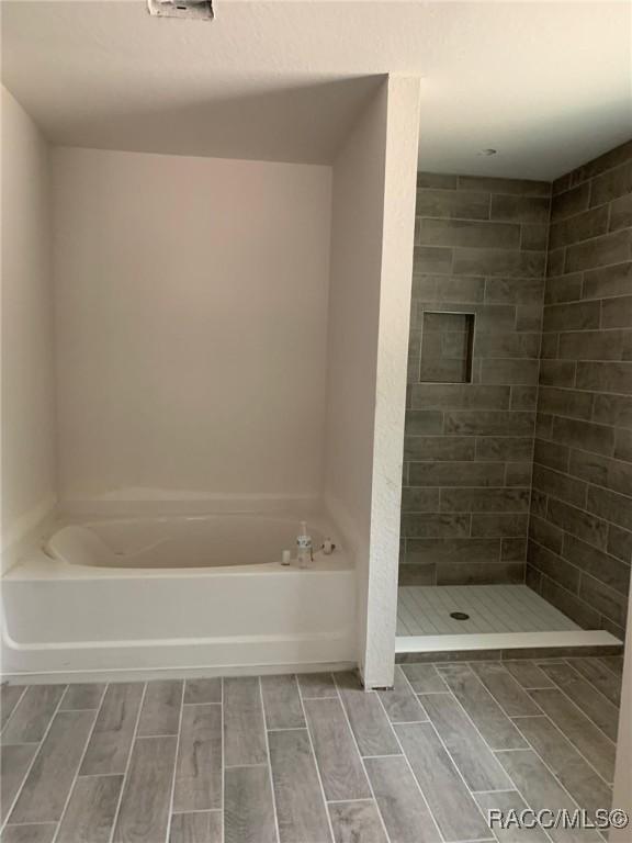 bathroom with plus walk in shower