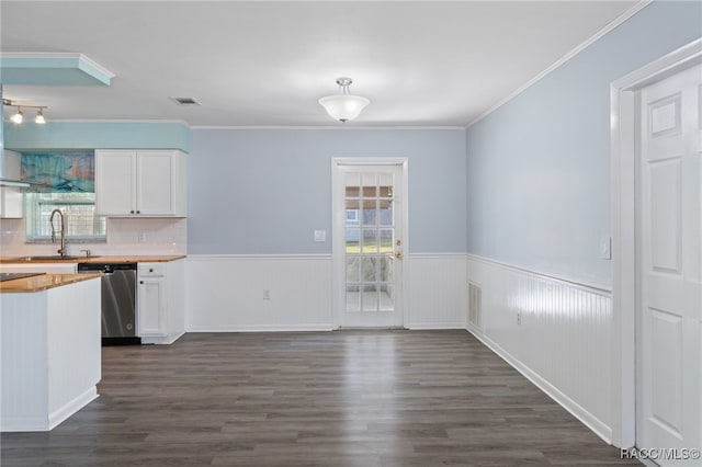 kitchen featuring sink, stainless steel dishwasher, decorative backsplash, dark hardwood / wood-style flooring, and white cabinetry