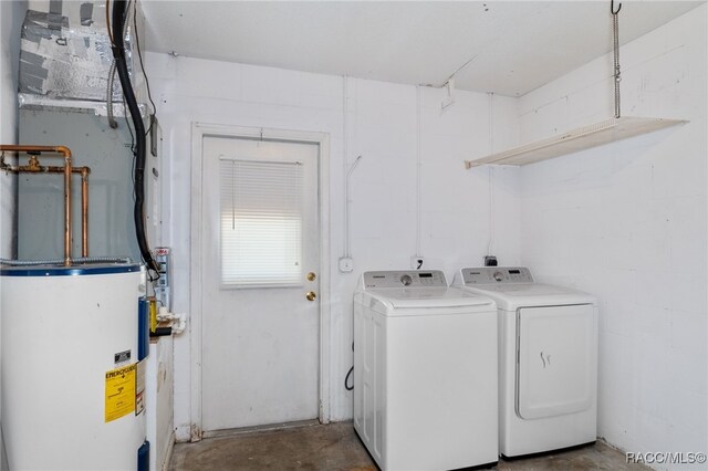 washroom featuring separate washer and dryer and water heater