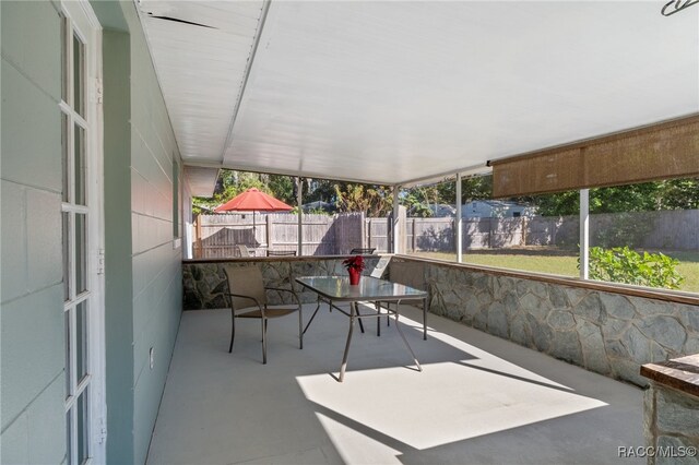 unfurnished sunroom with a wealth of natural light