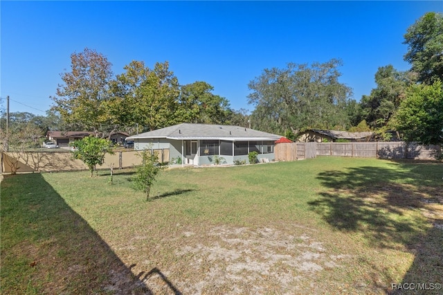 view of yard with a sunroom