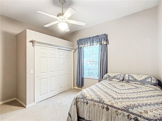 bedroom featuring carpet flooring, a closet, and ceiling fan