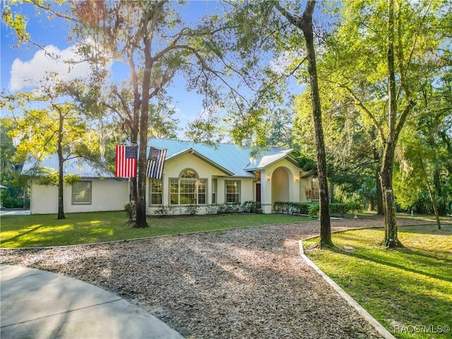 single story home with a front yard