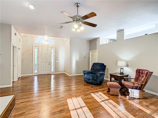 foyer with ceiling fan and hardwood / wood-style flooring