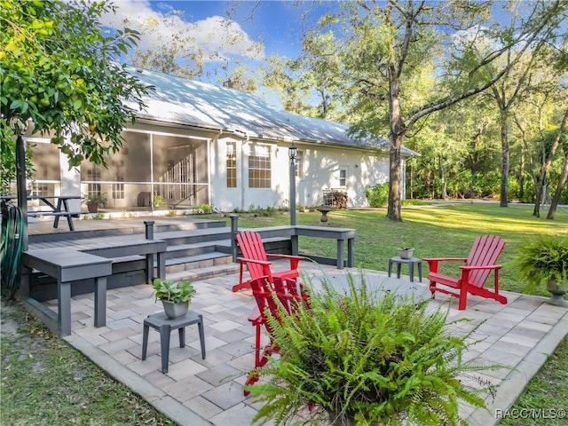 view of patio with a sunroom and a deck