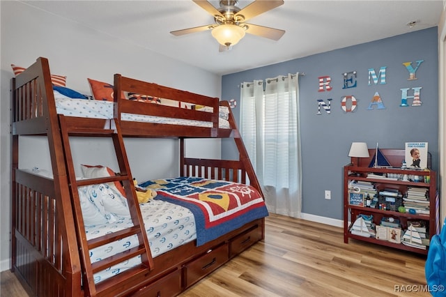 bedroom with ceiling fan and light wood-type flooring