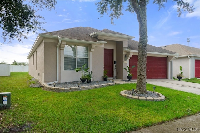 view of front of house with a front yard, a garage, and central air condition unit