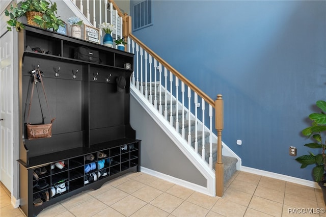 mudroom with tile patterned floors