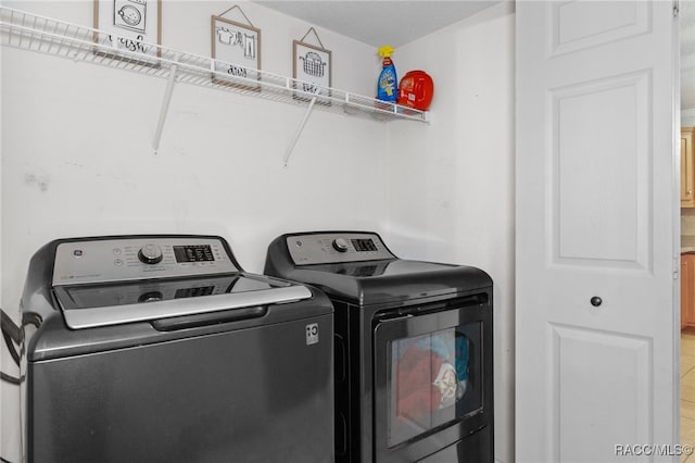 laundry area with washing machine and dryer