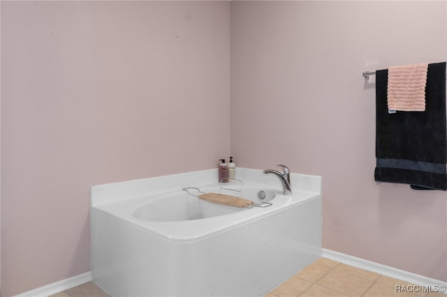 bathroom featuring tile patterned flooring and tiled tub