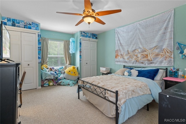 bedroom with light carpet and ceiling fan