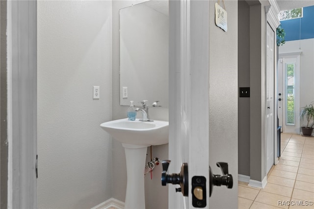 bathroom with tile patterned flooring