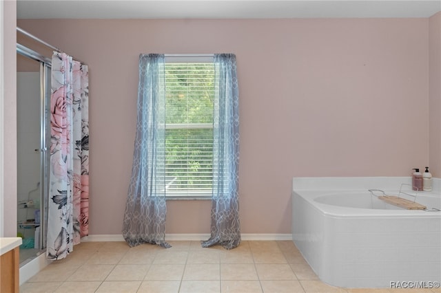 bathroom featuring tile patterned flooring and plus walk in shower