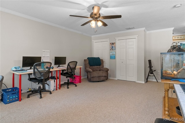 carpeted home office with a textured ceiling, ceiling fan, and crown molding