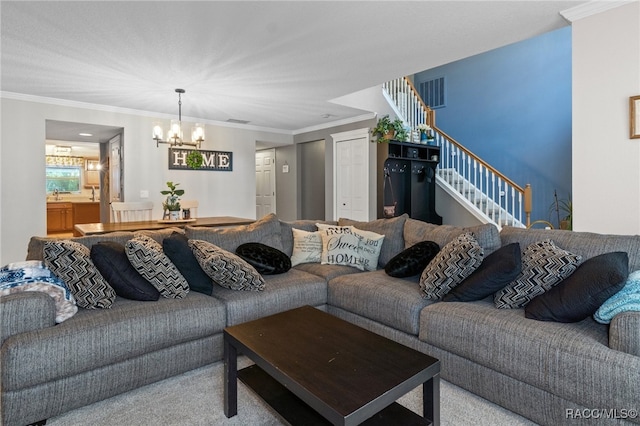 carpeted living room featuring an inviting chandelier and ornamental molding