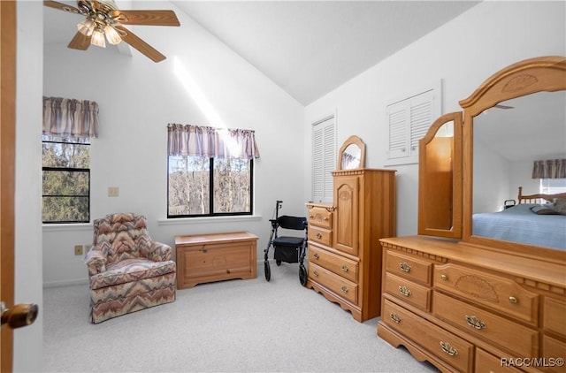 living area with lofted ceiling and light colored carpet