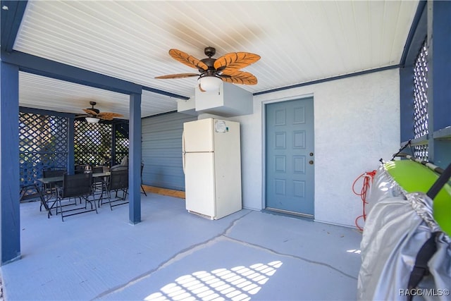 property entrance with ceiling fan and a patio