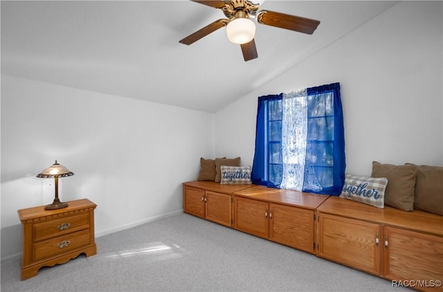 interior space featuring vaulted ceiling and ceiling fan