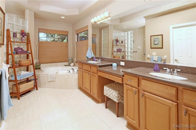 bathroom with separate shower and tub, tile patterned flooring, and vanity