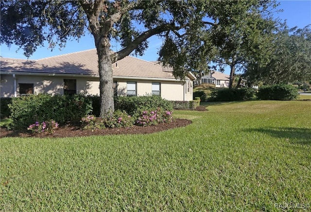 view of home's exterior with a lawn