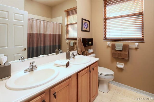 bathroom featuring tile patterned floors, a shower with curtain, vanity, and toilet