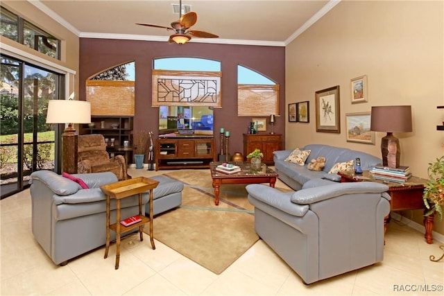 tiled living room featuring ceiling fan and crown molding