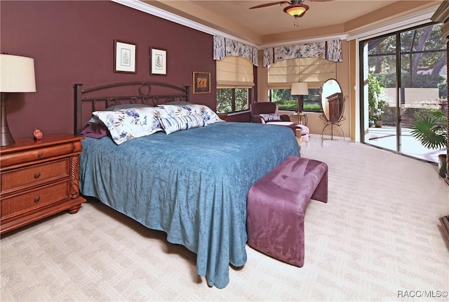 bedroom featuring access to exterior, light carpet, and ceiling fan