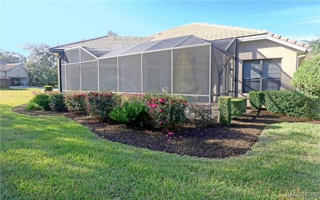 view of side of property with a yard