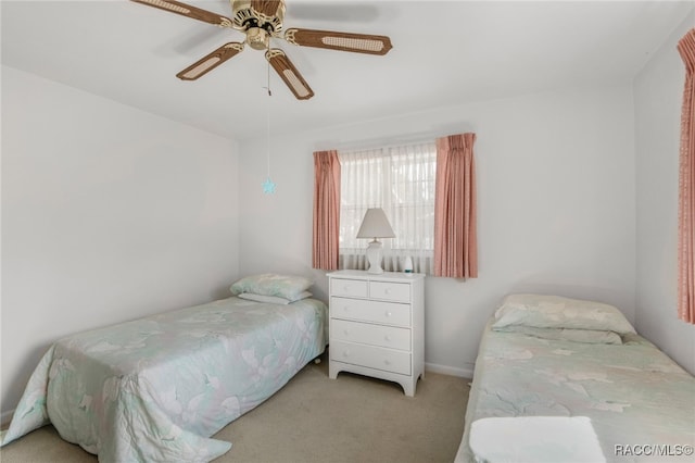 bedroom featuring ceiling fan and light colored carpet