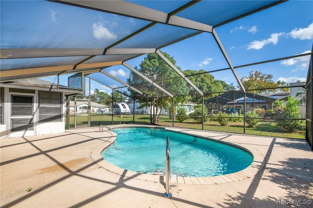 view of swimming pool with a lanai and a patio area