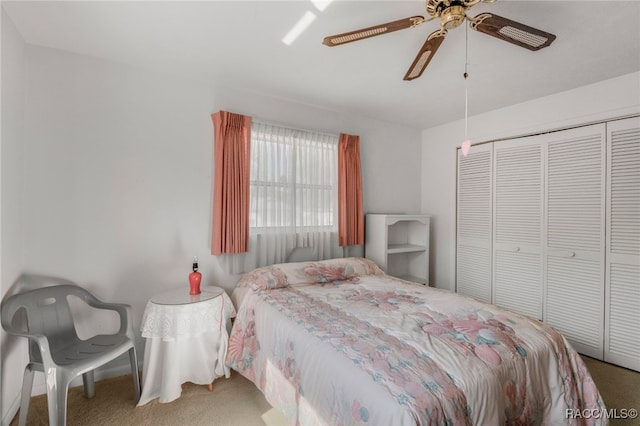 bedroom with carpet floors, a closet, and ceiling fan