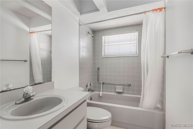 full bathroom featuring shower / tub combo with curtain, vanity, and toilet