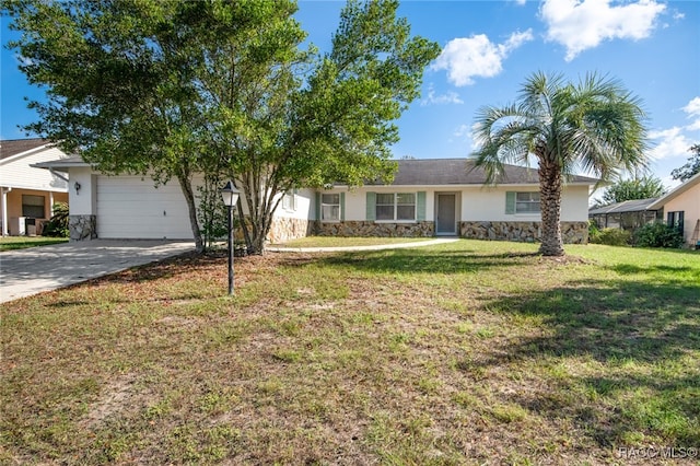 ranch-style home with a front lawn and a garage