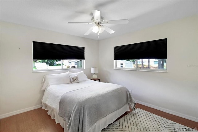 bedroom featuring ceiling fan and hardwood / wood-style floors