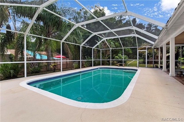 view of pool featuring a lanai and a patio area