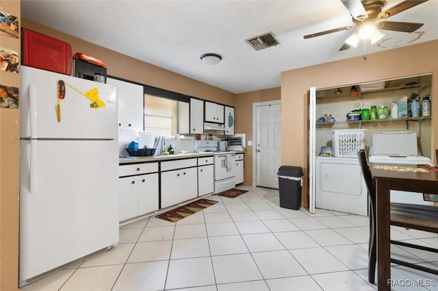 kitchen featuring white appliances, white cabinetry, ceiling fan, and light tile patterned flooring