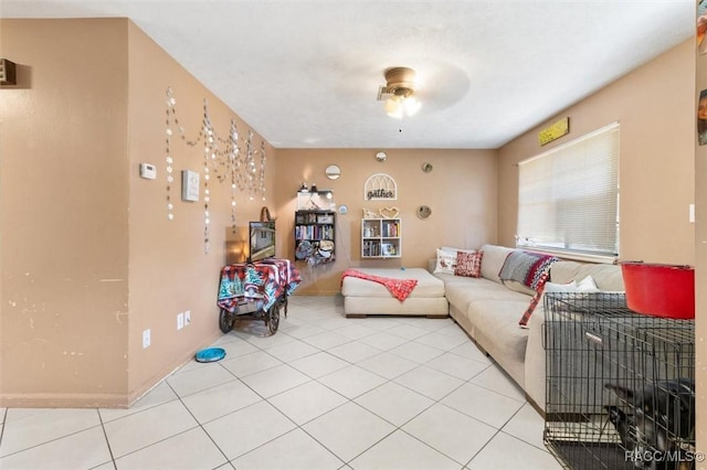 living room featuring ceiling fan and light tile patterned floors