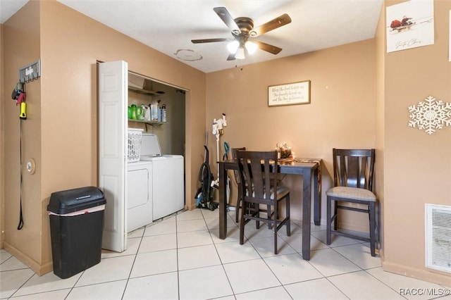 laundry room featuring ceiling fan, light tile patterned flooring, and independent washer and dryer