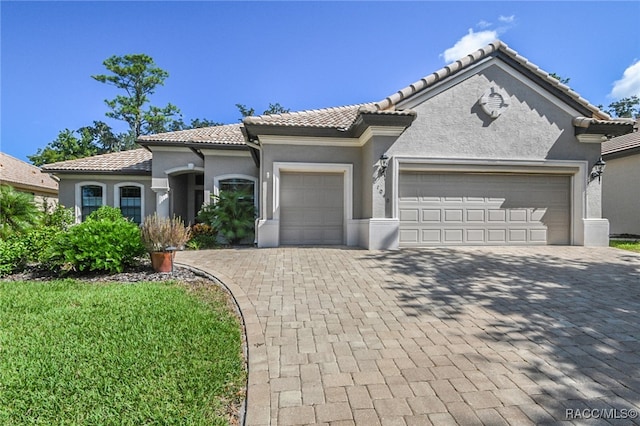 view of front of property with a garage