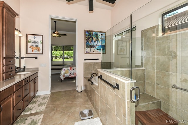 bathroom with vanity, tile patterned flooring, ceiling fan, ornamental molding, and independent shower and bath