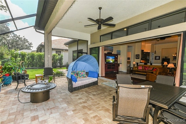 view of patio with a lanai and ceiling fan