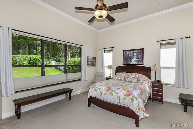 bedroom with ceiling fan, crown molding, and light colored carpet