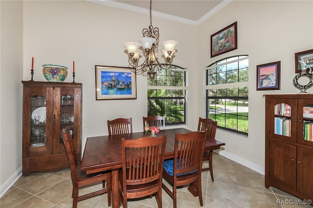 dining area with light tile patterned floors, an inviting chandelier, and ornamental molding