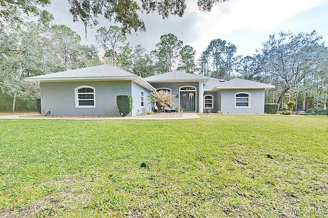 single story home with a front lawn and stucco siding