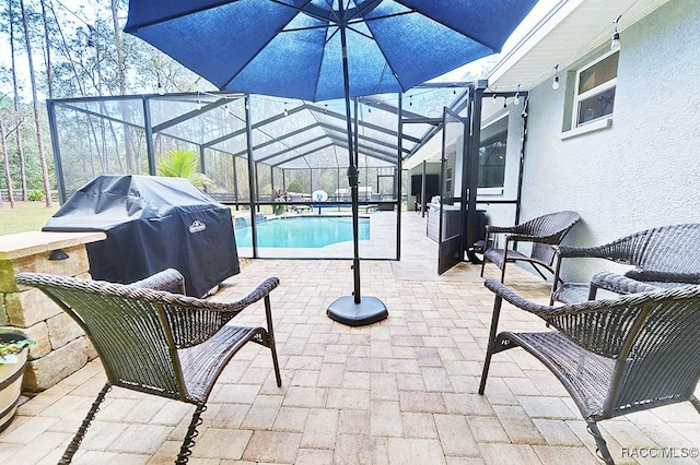 outdoor pool with a patio, grilling area, and a lanai