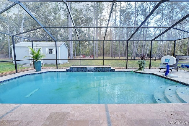 pool with a patio area, a storage shed, an outdoor structure, and a lanai