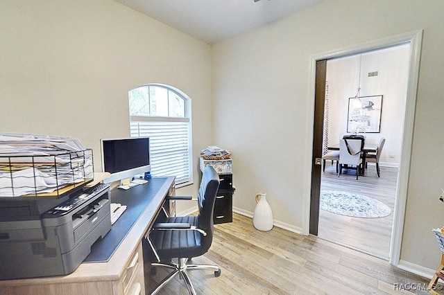 office featuring light wood-style floors and baseboards