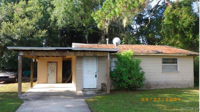 view of outbuilding with a carport