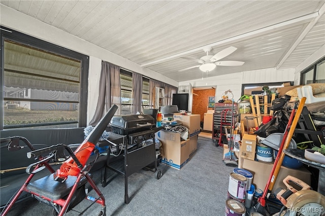 interior space with ceiling fan